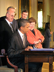 President Obama Signing a bill into law